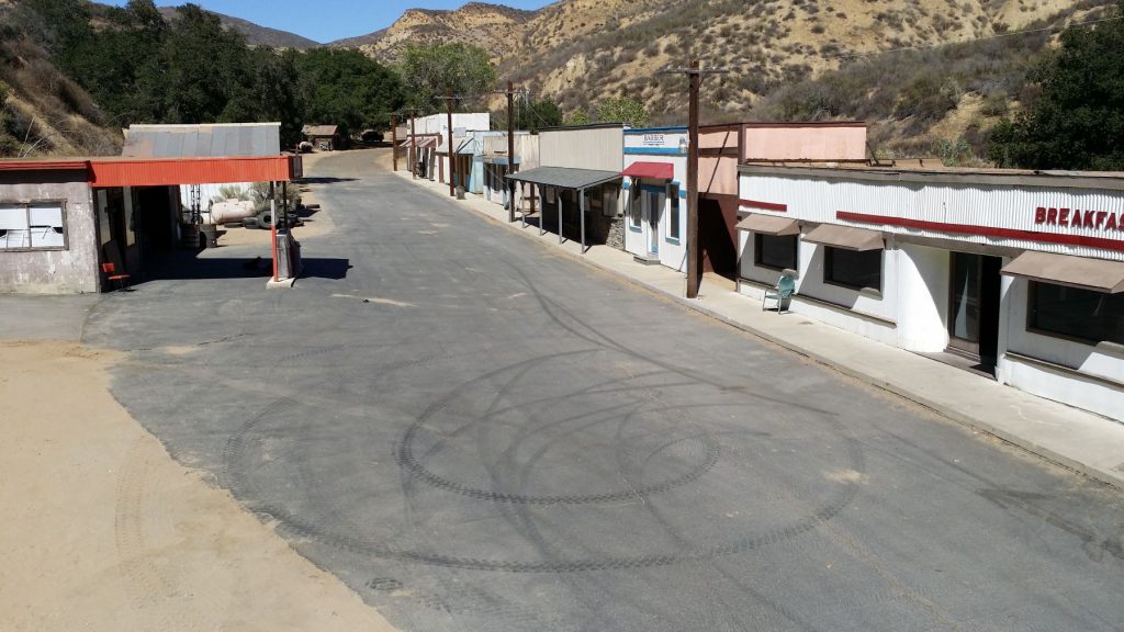 street front with tire marks on road in diamond v ranch