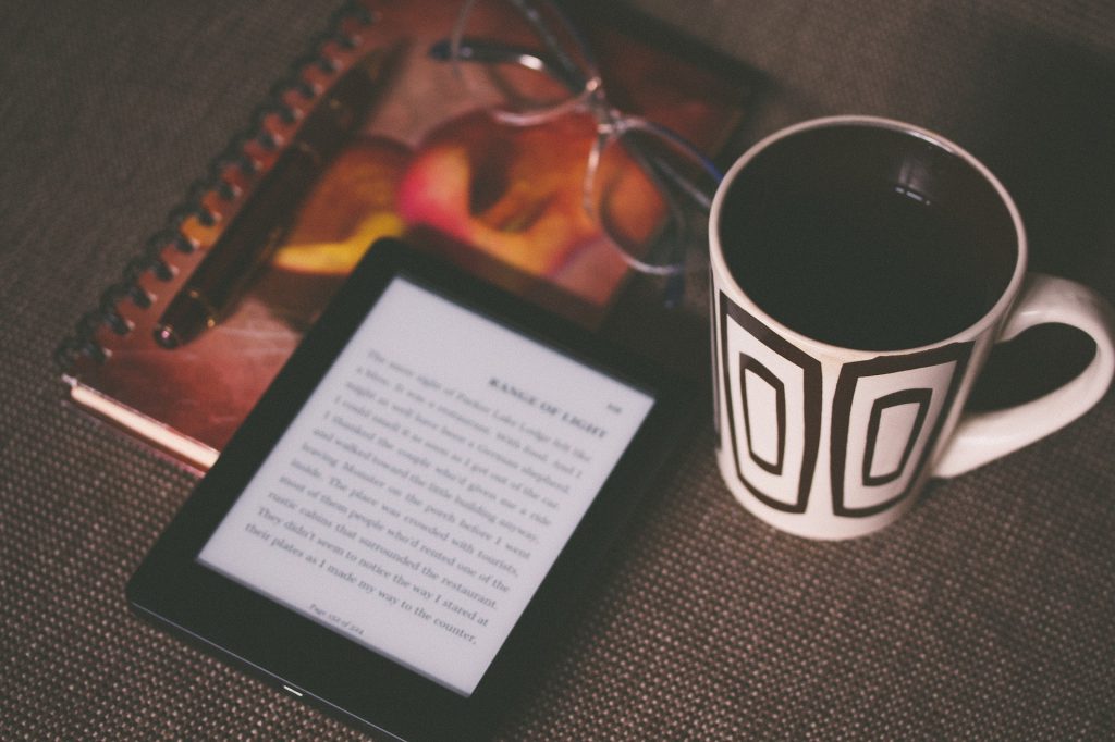 amazon kindle and coffee mug