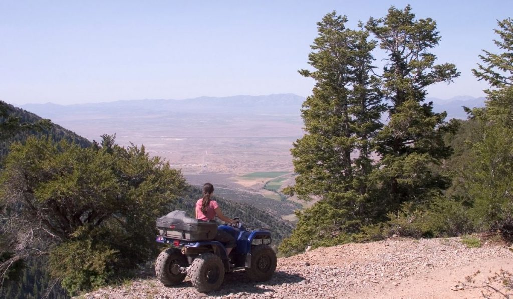 ATV rider enjoys the mountain valley view