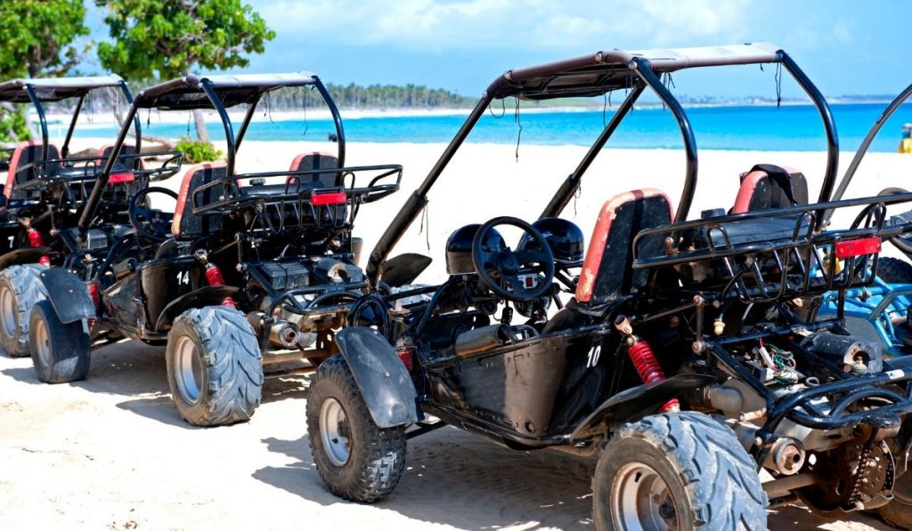 dune buggies parked on the beach