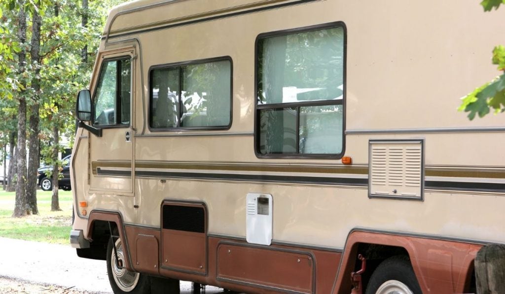 second hand RV parked in a park